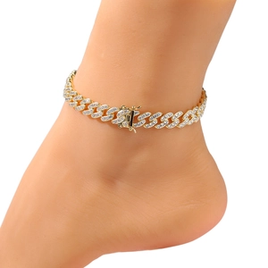 Close-up of 9mm gold plated hip hop anklet with sparkling zircon stones on an ankle