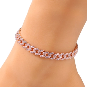 Detailed close-up of a 9mm rose gold cuban link anklet with pink zircon stones on ankle