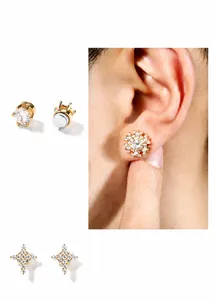 Detail of hip hop gold magnetic earrings with snowflake, star, and round zircon studs