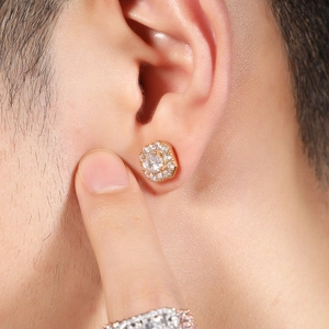 Close-up of a 8mm golden hexagon magnetic earring with crystal cross and zircon stones