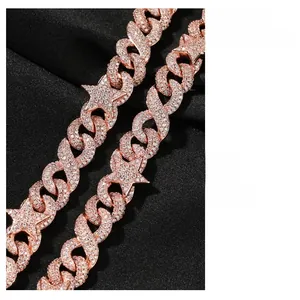 Detail of 10mm pink rose gold Cuban chain with iced out star clasp and zircon stones