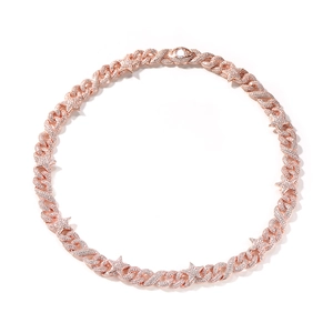 Detailed close-up of rose gold Cuban link chain with iced-out star charms and stones