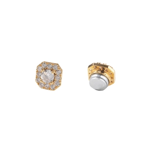 Macro detail of magnetic earring featuring octagonal zircon design and secure back attachment