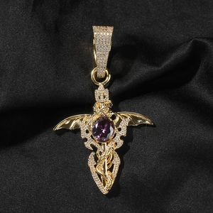 Close-up of golden dragon sword pendant with purple stone and zircon inlay on black silk