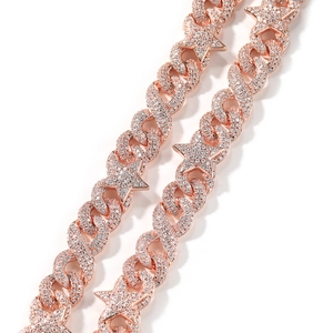 Close-up of rose gold Cuban link chain with star pendants and white zircon pavé setting