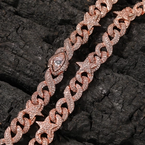 Macro shot of rose gold hip hop Cuban chain with star links and white zircon stones