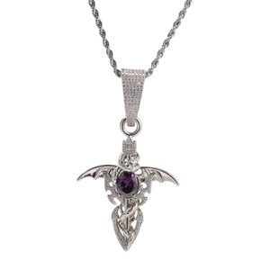Macro shot of silver hip-hop sword pendant with purple zircon and bat wings detail