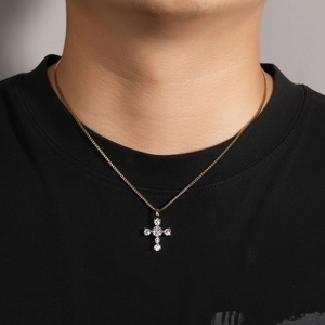 Close-up of a gold-plated S925 silver cross pendant necklace with clear cubic zirconia