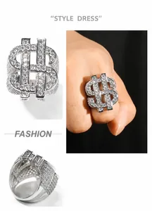 Macro detail of silver hip hop ring with dollar sign and micro-paved cubic zirconia