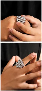 Close-up of hip-hop silver ring featuring dollar signs and full zircon pavé stones