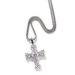 Close-up of S925 silver cross pendant with six round-cut clear cubic zirconia stones