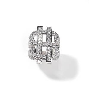 Detail of hip hop iced out ring with dollar sign and pave cubic zirconia stones