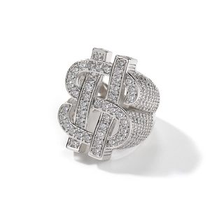 Macro shot of silver hip hop ring with dollar sign and pave set cubic zirconia crystals
