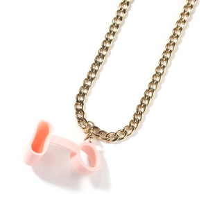 Close-up of bright gold chunky chain with pink silicone strap for electronic devices