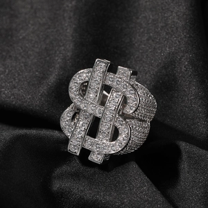 Macro shot of silver hip hop ring with dollar sign and pave set cubic zirconia stones
