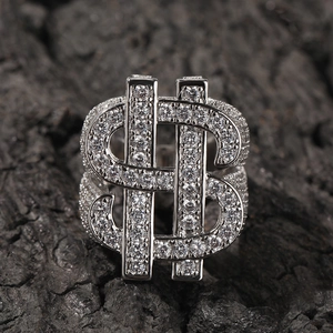 Macro close-up of hip-hop silver dollar sign ring with sparkling pavé cubic zirconia