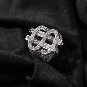 Macro detail of iced-out dollar sign ring featuring silver-tone plating and cubic zirconia
