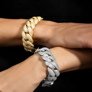Detail showing gold and silver Cuban chain bracelets with handset cubic zirconia