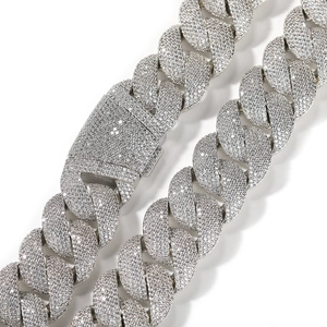 Macro shot of high-density paved zircons on 24mm silver-tone Cuban link necklace