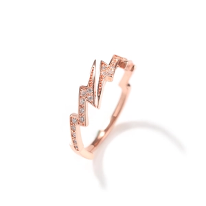 Macro detail of lightning bolt ring in rose gold with shimmering cubic zirconia accents