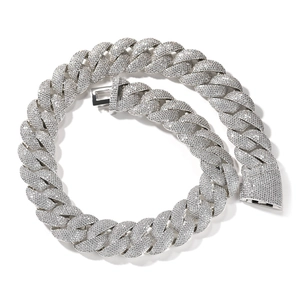Detailed close-up of iced out Cuban link chain with sparkling micro-pave crystals