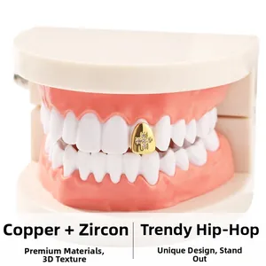 Macro-opname van hiphop gouden tandgrillz van koper met ingelegde zirkoon kruisvorm