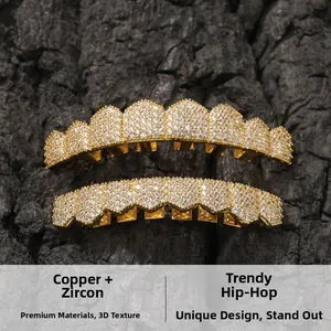 Detailed macro view of gold plated copper grillz with cubic zirconia on black texture
