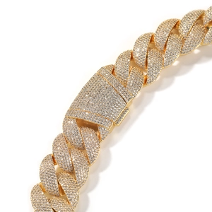 Detailed view of iced out 24mm Cuban link chain with gold plating and cubic zirconia