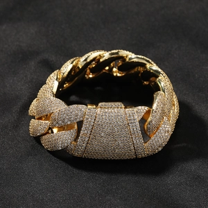 Detail of gold Cuban link bracelet with micro-pave zircons and heavy secure clasp