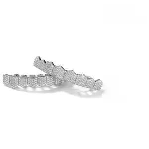 Macro detail of silver hip-hop grillz showing micro-pave cubic zirconia zircon stones