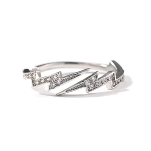 Detail of silver lightning bolt ring with sparkling cubic zirconia on white background