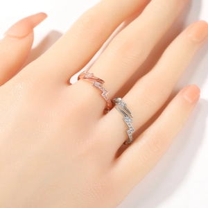Hip hop lightning ring with cubic zirconia in rose gold and silver on model hand
