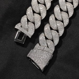 Close-up of iced out Cuban chain necklace with zircon stones and heavy box clasp