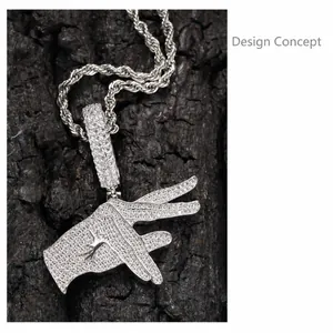 Detail of hip hop hand sign pendant with sparkling zircons on textured wood background