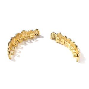 Hip-hop gold grillz set with cubic zirconia stones and star cutout design backings