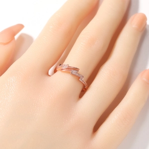 Close-up of rose gold lightning bolt ring featuring sparkling cubic zirconia crystals