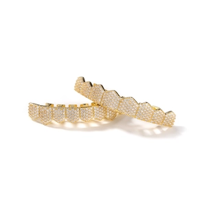 Macro shot of hip hop gold teeth grillz with pave-set cubic zirconia stones