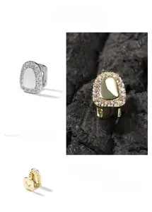 Close-up of hip hop teeth grillz with micro-pave cubic zirconia in gold and silver plating