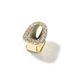 Close-up of a hip hop gold dental grill set with a circle of sparkling cubic zirconia