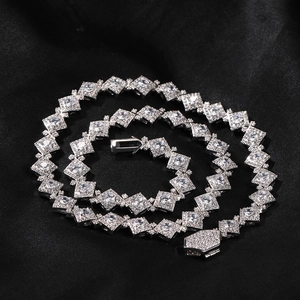 Detail of iced out hip hop square necklace with micro pave diamonds on black silk