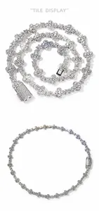 Detailed macro view of silver clover chain links with shimmering crystal pavé setting