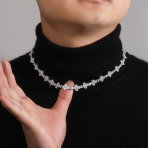 Hip hop 10mm cross floral iced out necklace in silver finish worn on black sweater