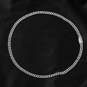 Close-up of a 6mm silver moissanite Cuban chain with a diamond-encrusted box clasp