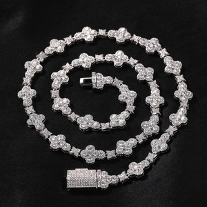 Iced out 10mm hip hop cross flower necklace with cubic zirconia on black silk background