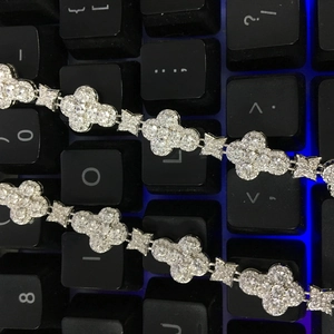Detailed macro view of 10mm flower necklace with inlaid diamonds and star links
