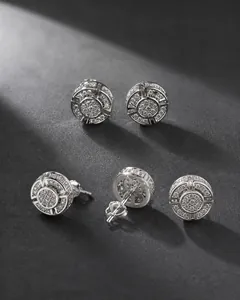 Macro shot of hip-hop round stud earrings with sparkling pavé stones and screw-back closure