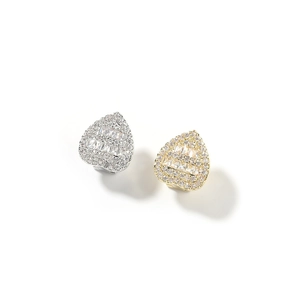 Close-up of heart shaped stud earrings with micro paved cubic zirconia and baguette stones