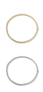 Macro detail of 7mm tennis necklaces with cubic zirconia in gold and silver finish