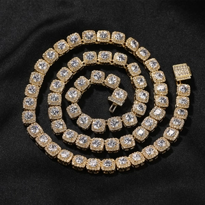 Macro shot of gold hip-hop chain with square zircon links and iced out pavé details
