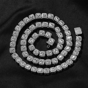 Macro detail of iced out hip hop chain with square zircon stones and a box clasp closure